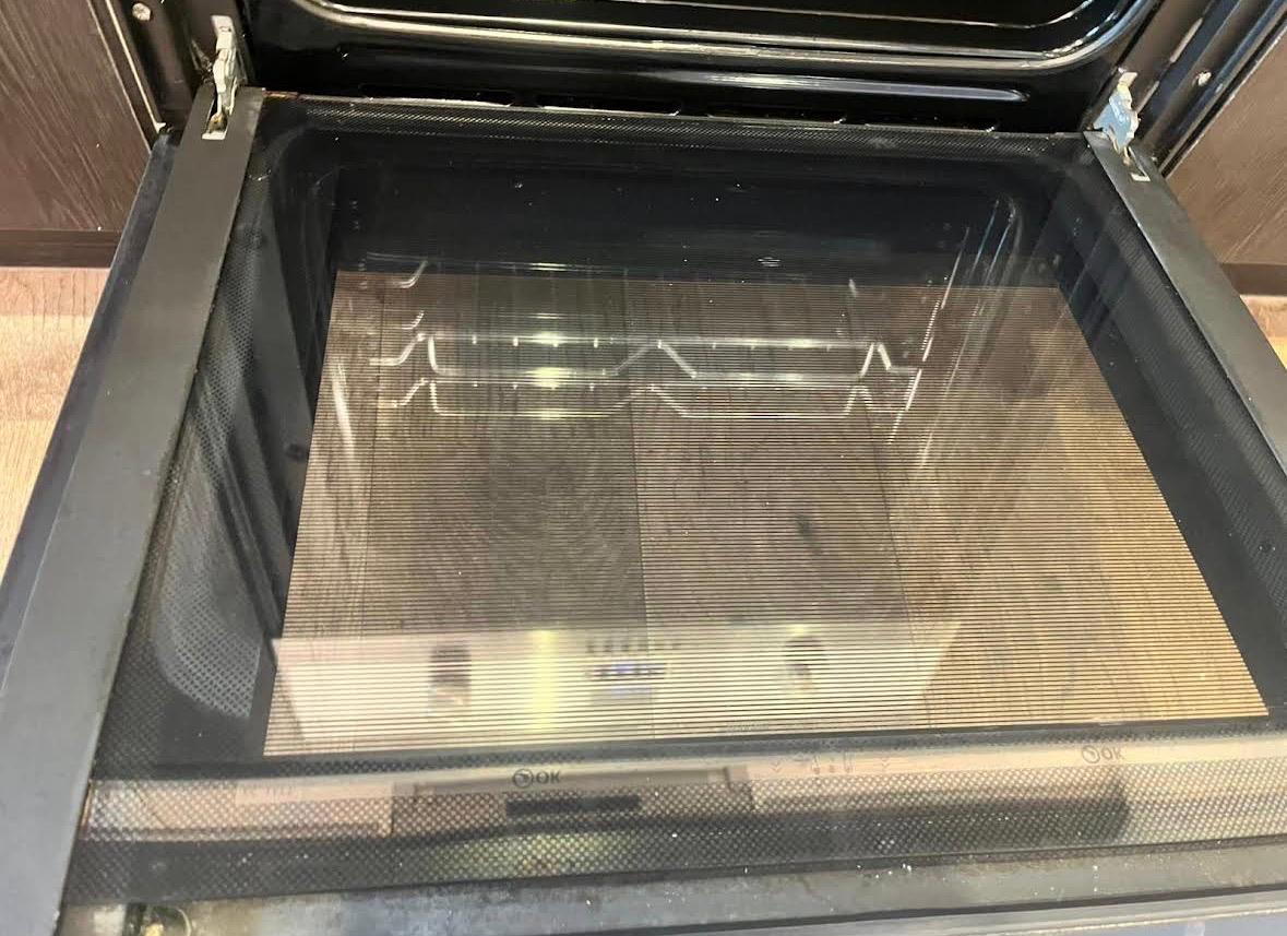 Intensive oven degreasing and kitchen appliance detailing during deep cleaning in Logan