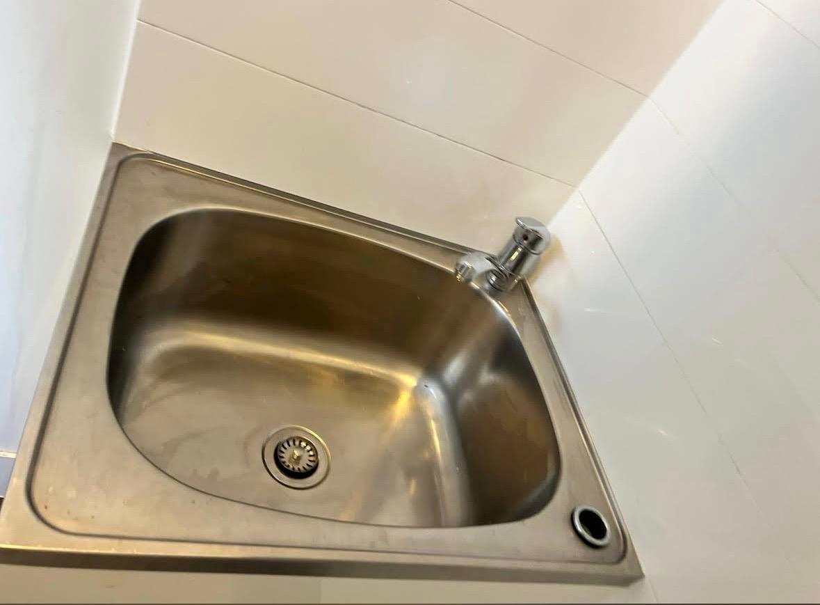 Bathroom descaling, tile scrubbing, and sanitisation performed during deep cleaning in Logan